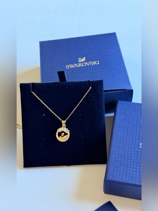 Swarovski Jewelry - Swarovski Gold Swan Circle Pendant Necklace with Blue Packaging